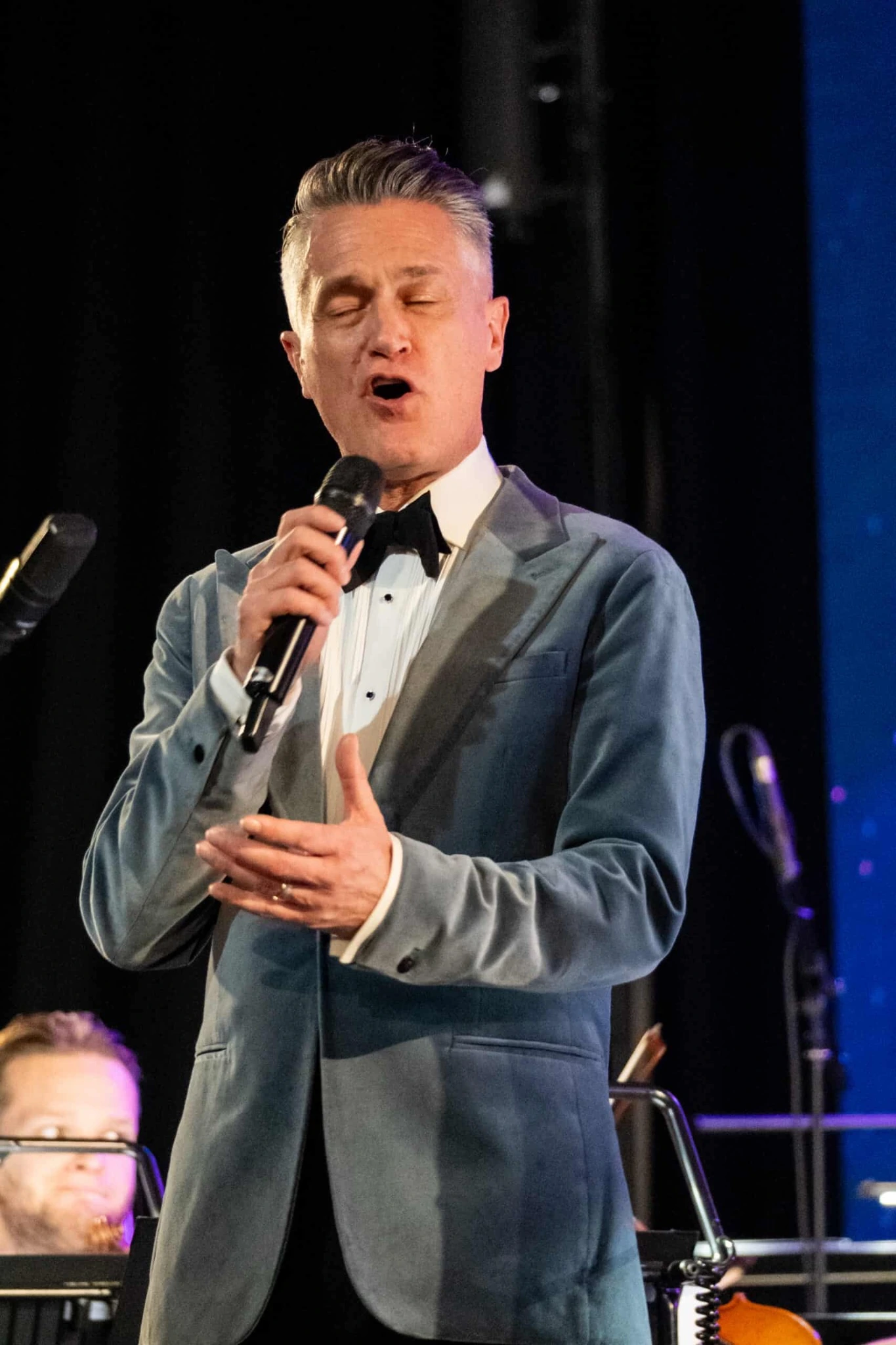 Male singer holding a microphone
