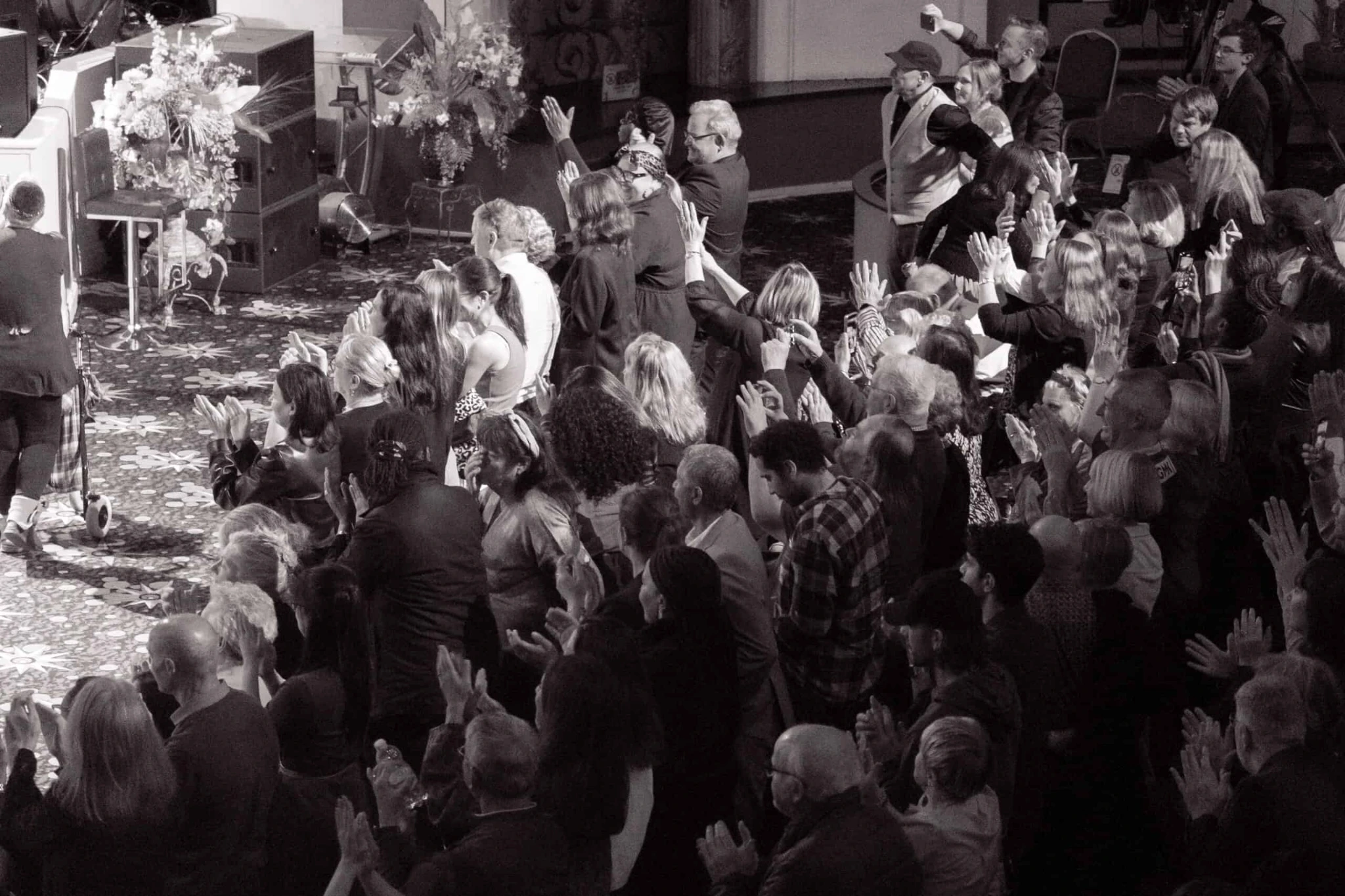 Standing ovation with audience applauding at the end of the concert
