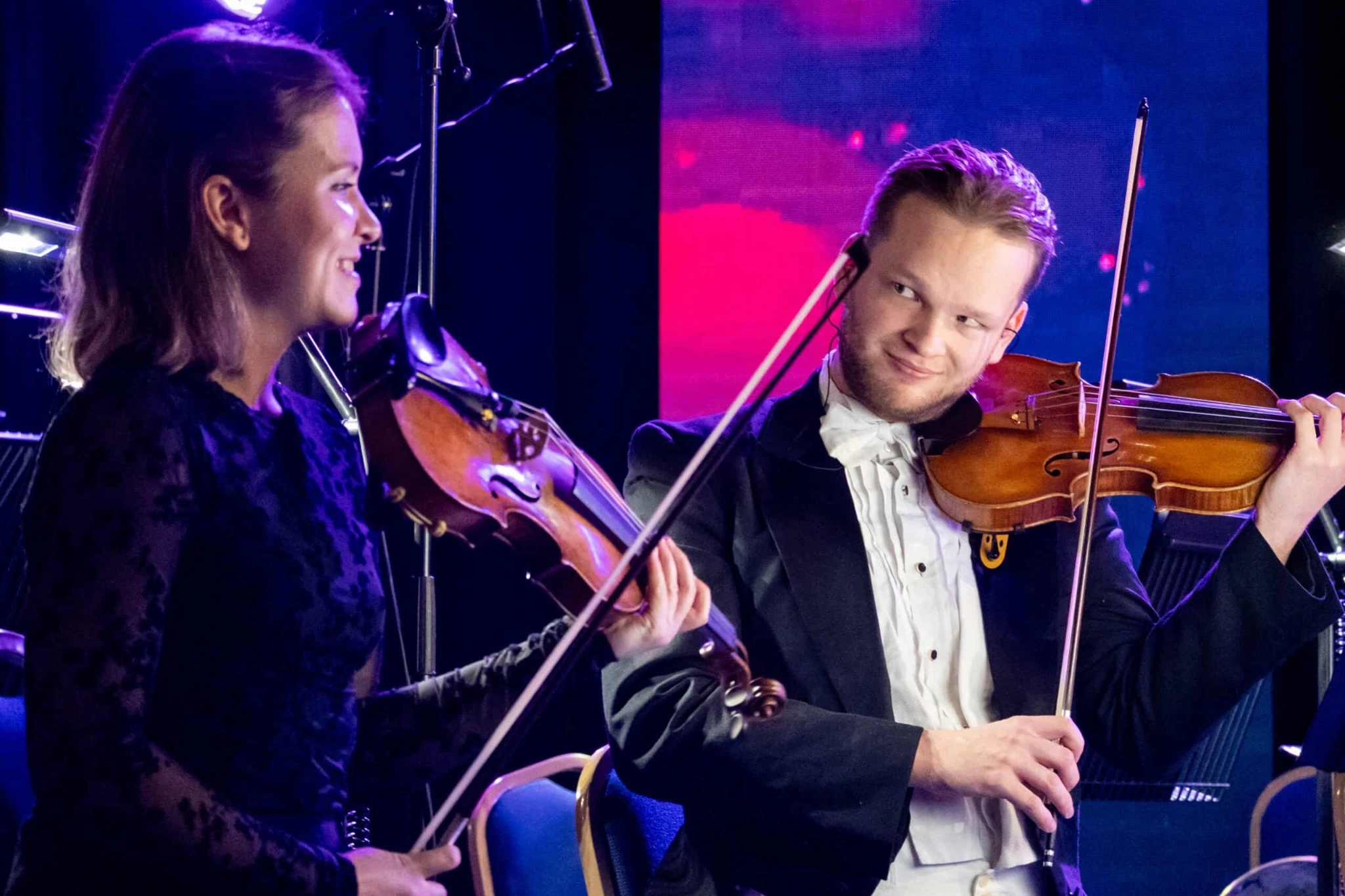 Two violinists on stage