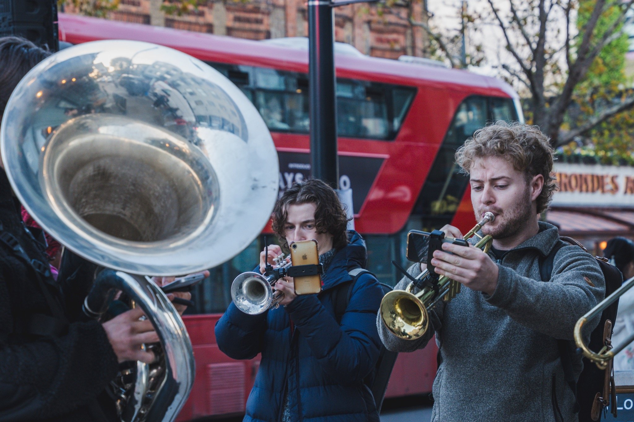 Brass players performing on Kilburn High Road