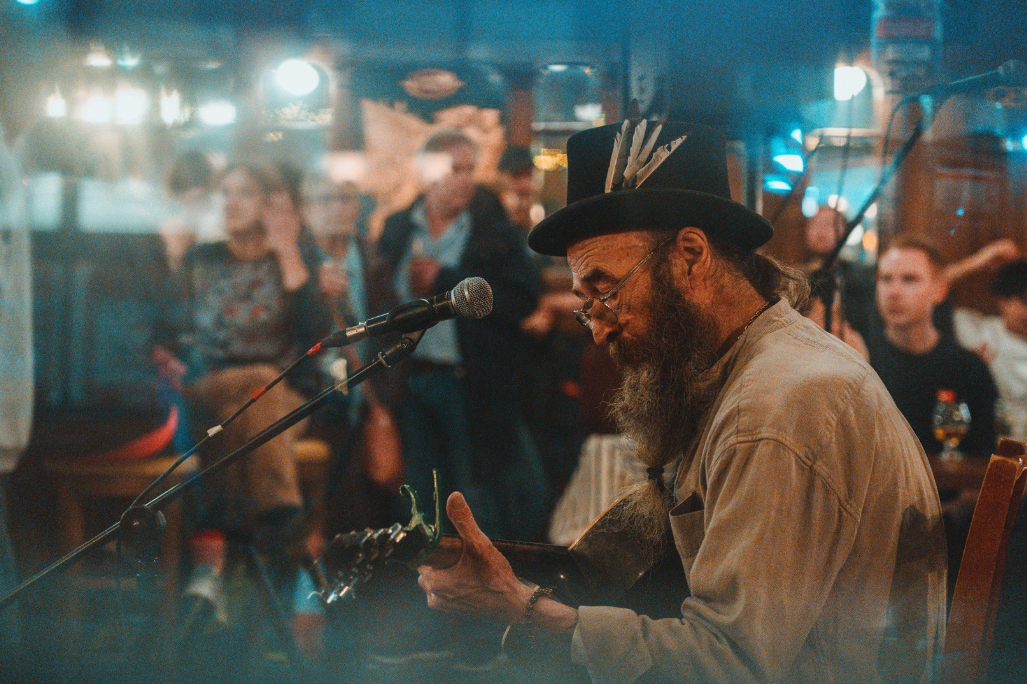 Jimmy playing guitar with the audience at the Black Lion